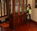 Woman moving china cabinet across wood floor with Professional Furniture Slides for Hardwood and Tile (Set of 4)