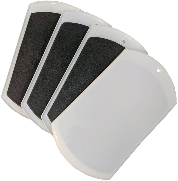 Unpackaged set of four Professional Furniture Slides for Carpet on white background.