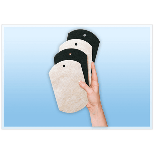 Unpackaged set of Professional Furniture Slides for Hardwood and Tile help in a hand on blue background.