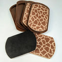 Four unpackaged Giraffe print 2-In-1 Furniture Slides, Animal Print (Set of 4), two with felt removed.