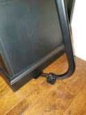 PowerMaxx Furniture Lifter under black cabinet